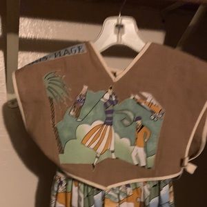 A children’s dress from Paris France size small for a petite child.